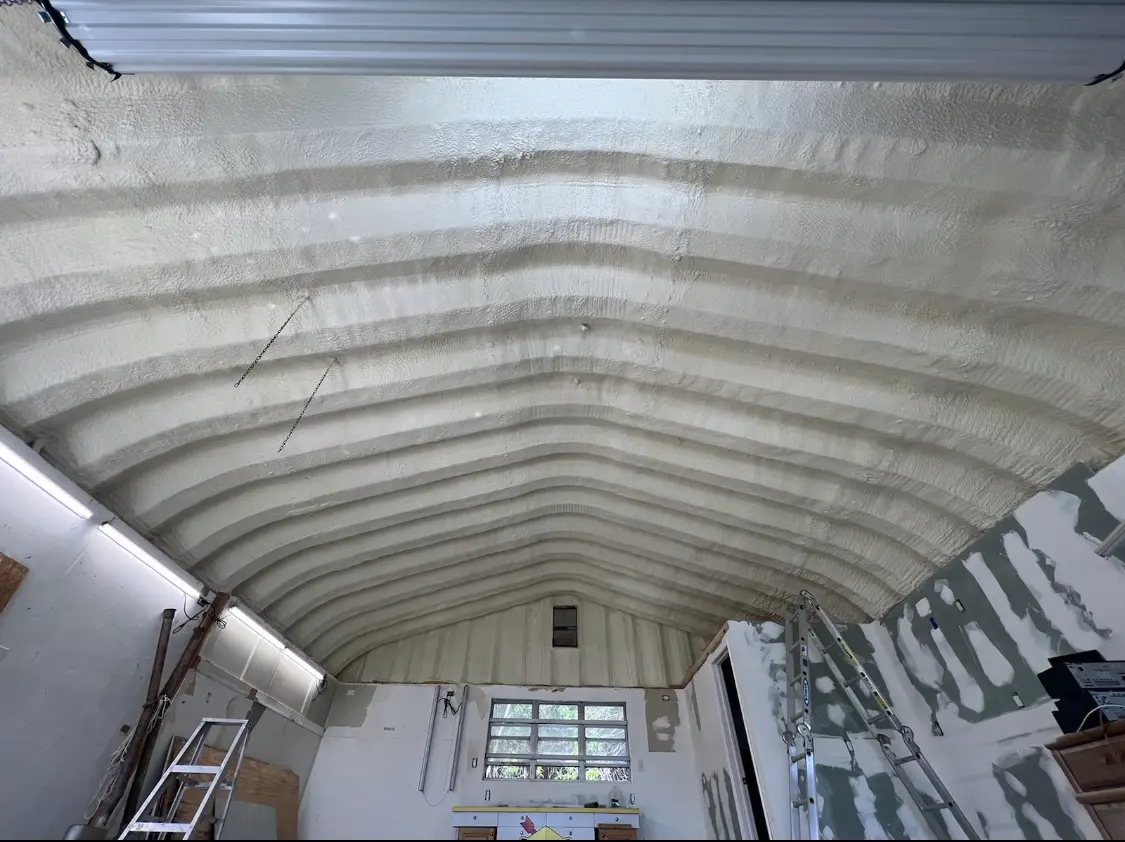 Spray polyurethane foam applied to the underside of a metal roof deck in Pawling